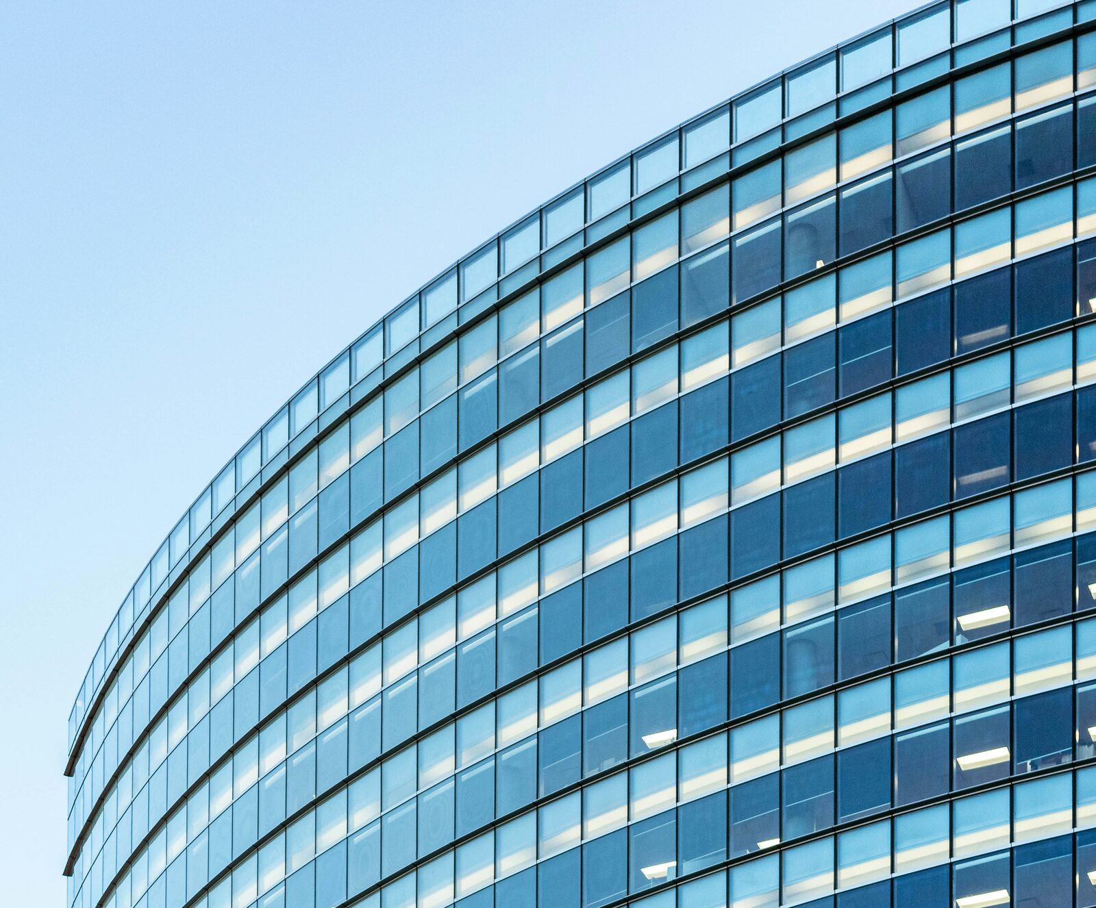 A modern curved glass corporate headquarters
