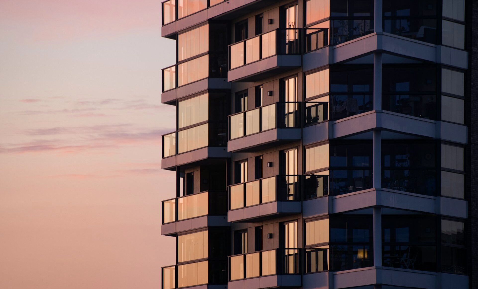 A premium residential building at dusk